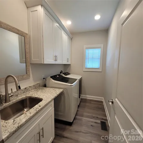 a kitchen that has a sink and a stove in it