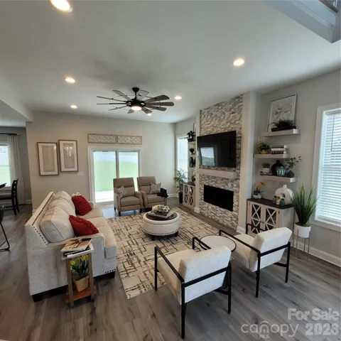a living room with furniture and a flat screen tv