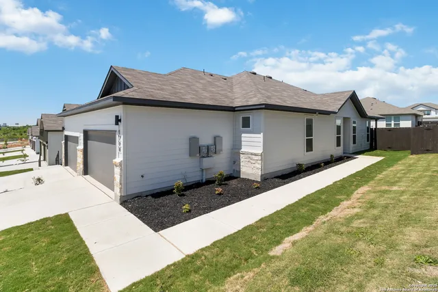 a aerial view of a house with a yard