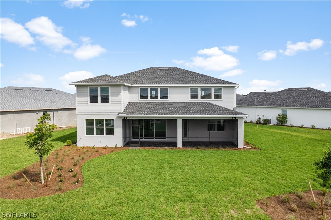 42548 Little Ridge Road Punta Gorda, FL 33982 - Photo 2 of 50 a front view of a house with a yard