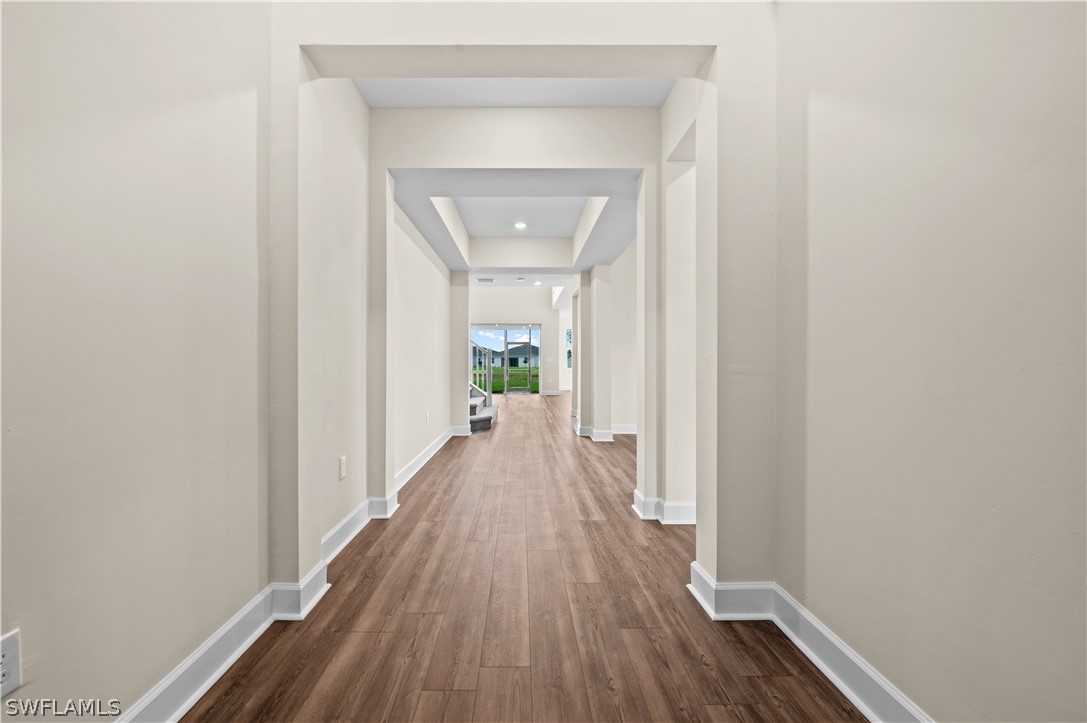 42548 Little Ridge Road Punta Gorda, FL 33982 - Photo 33 of 50 a view of a hallway with wooden floor