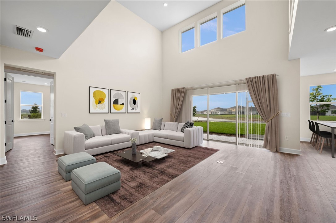 42548 Little Ridge Road Punta Gorda, FL 33982 - Photo 8 of 50 a living room with furniture and a wooden floor