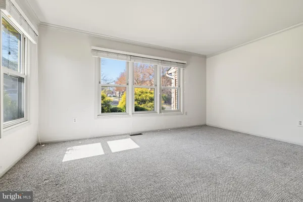 an empty room with windows