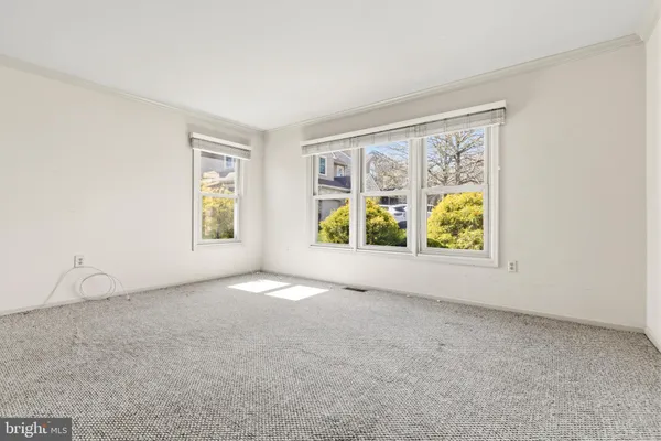 an empty room with windows