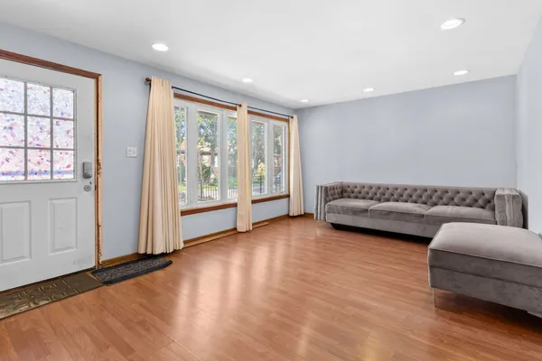 a view of a livingroom with furniture and wooden floor