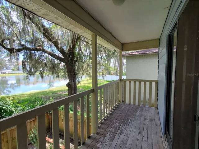 a view of a balcony with wooden floor