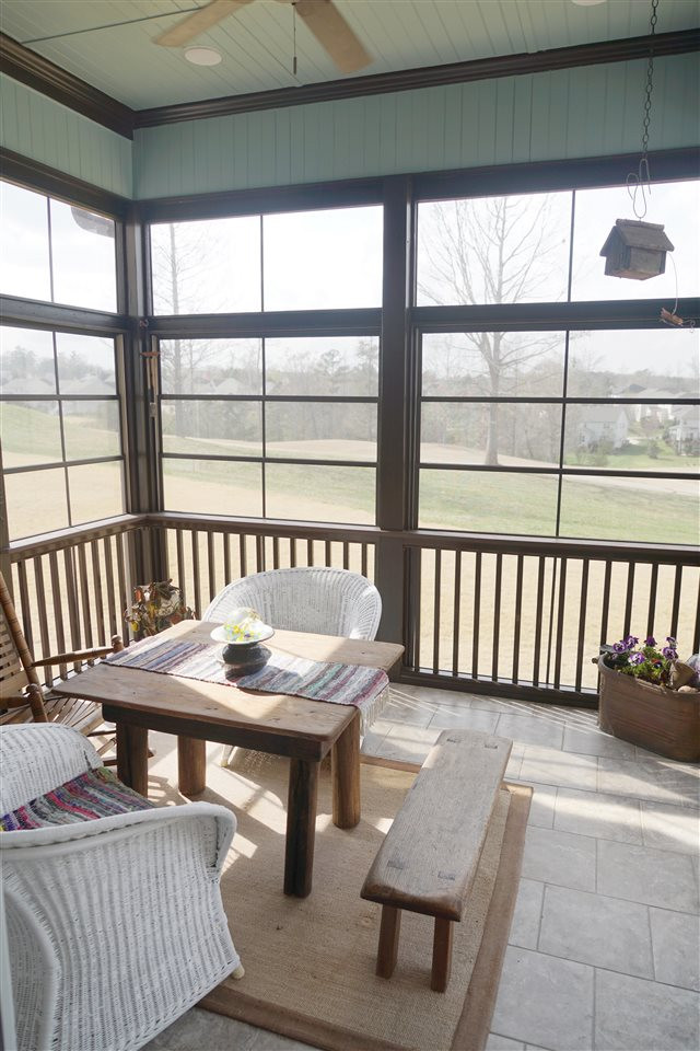 607 Competition Road Raleigh, NC 27603 - Photo 12 of 20 Sunroom with windows for pollen-free enjoyment, door leading to deck, tile floor, and also fully screened