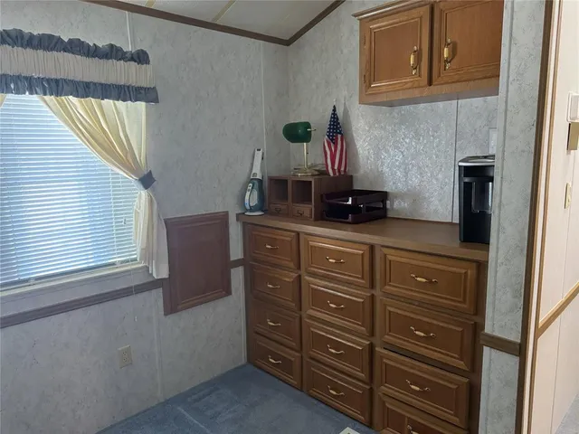 a kitchen with a cabinets and a stove