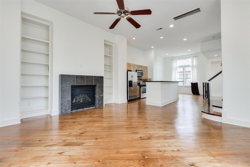 2002 Blodgett Street Houston, TX 77004 - Photo 17 of 43 a view of empty room with wooden floor and a fireplace
