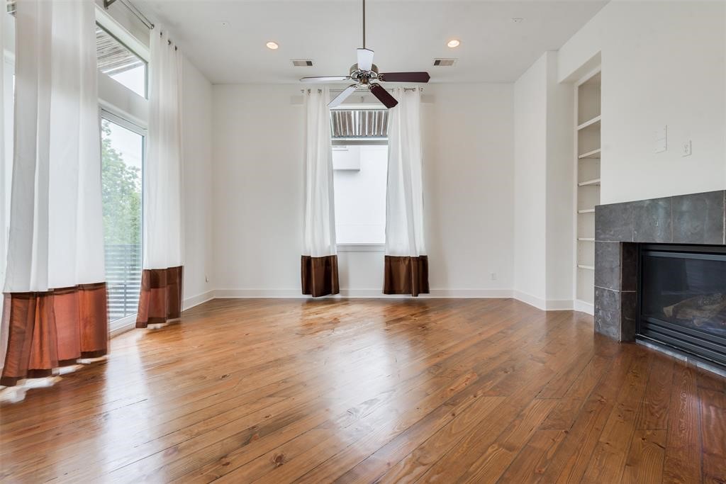 2002 Blodgett Street Houston, TX 77004 - Photo 19 of 43 a view of an empty room with wooden floor and a window