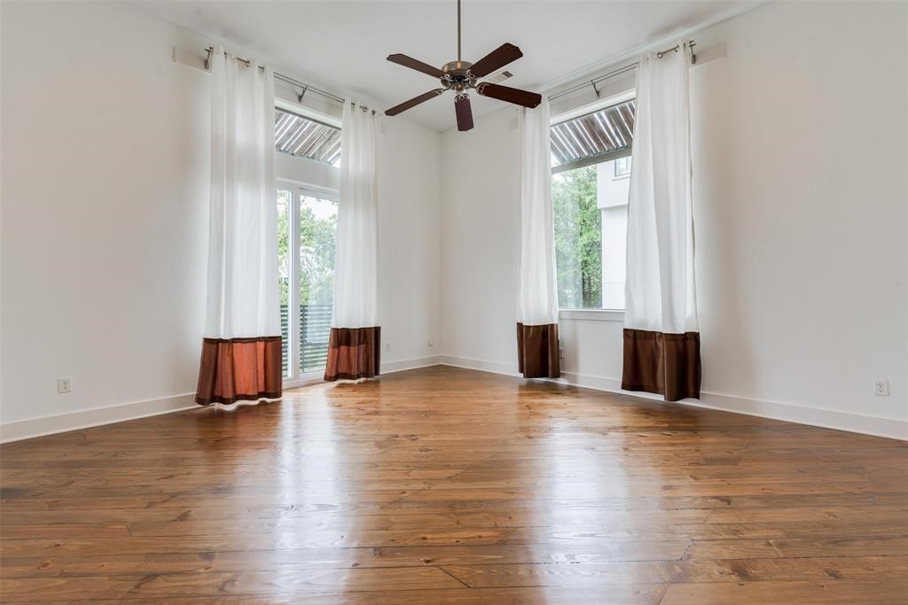 2002 Blodgett Street Houston, TX 77004 - Photo 20 of 43 a view of empty room with wooden floor and fan