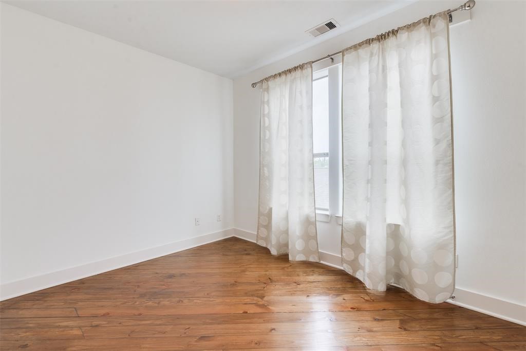 2002 Blodgett Street Houston, TX 77004 - Photo 29 of 43 a view of a room with wooden floor and bench