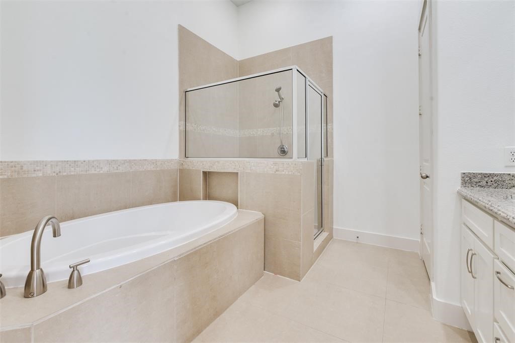2002 Blodgett Street Houston, TX 77004 - Photo 39 of 43 a bathroom with a tub a toilet and a sink