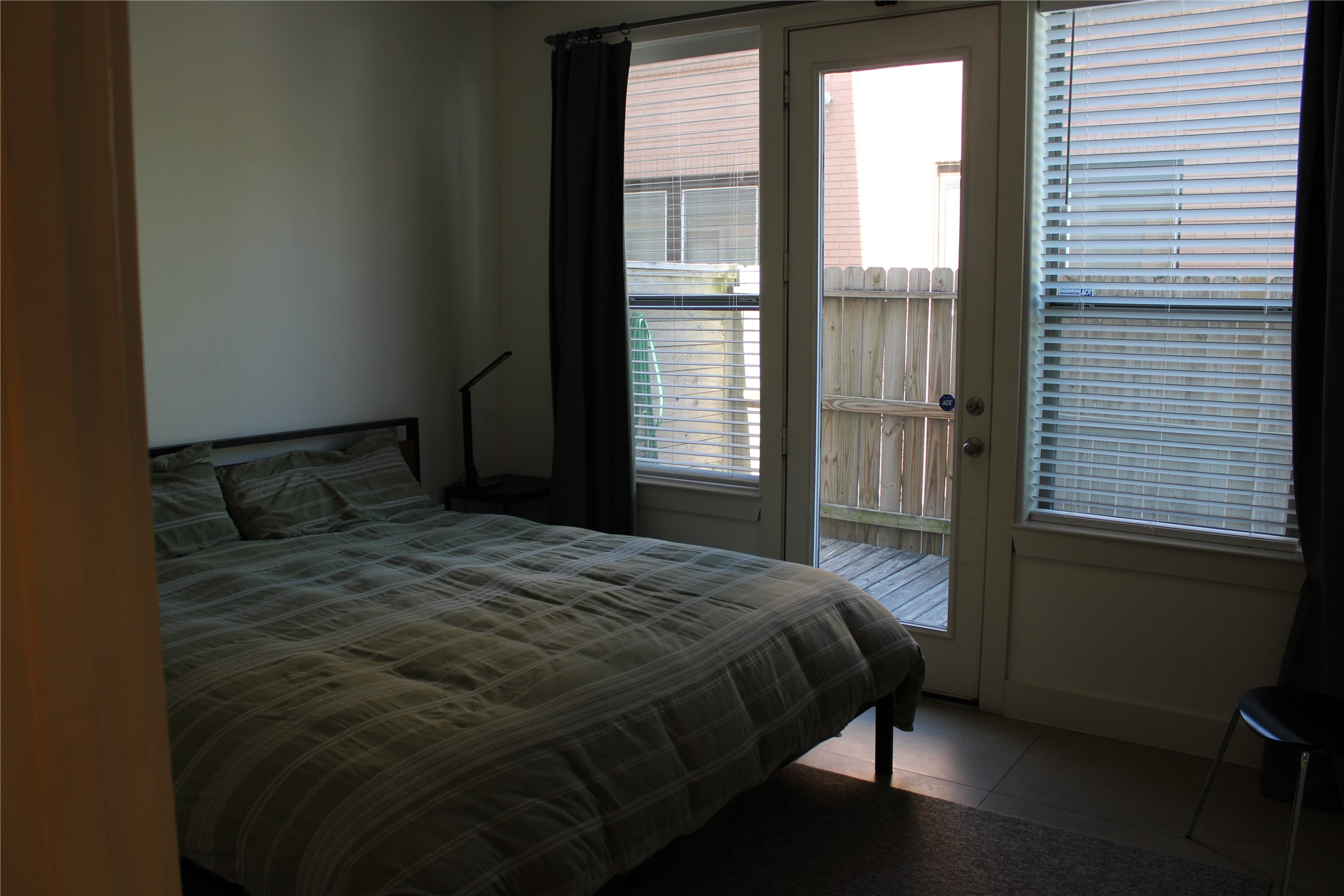 2002 Blodgett Street Houston, TX 77004 - Photo 7 of 43 a bedroom with a bed and wooden floor