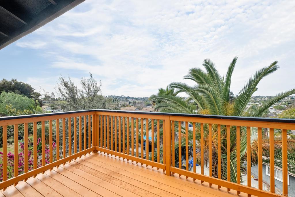 552 Felicita Avenue Spring Valley, CA 91977 - Photo 12 of 44 a balcony with wooden floor and fence