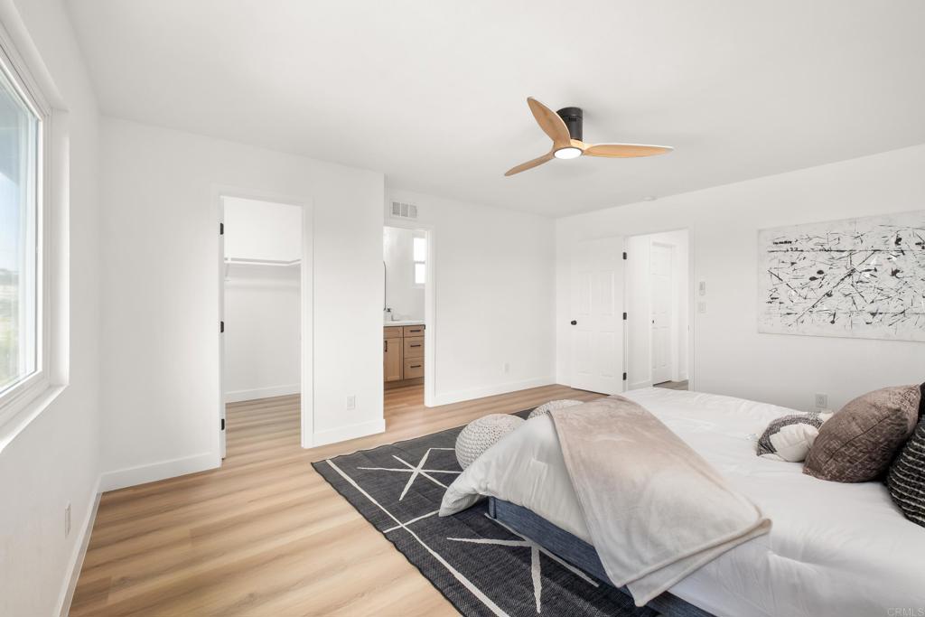 552 Felicita Avenue Spring Valley, CA 91977 - Photo 14 of 44 a bedroom with a bed and a ceiling fan
