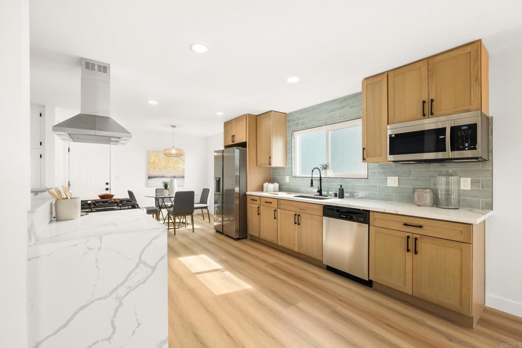 552 Felicita Avenue Spring Valley, CA 91977 - Photo 2 of 44 a large white kitchen with stainless steel appliances
