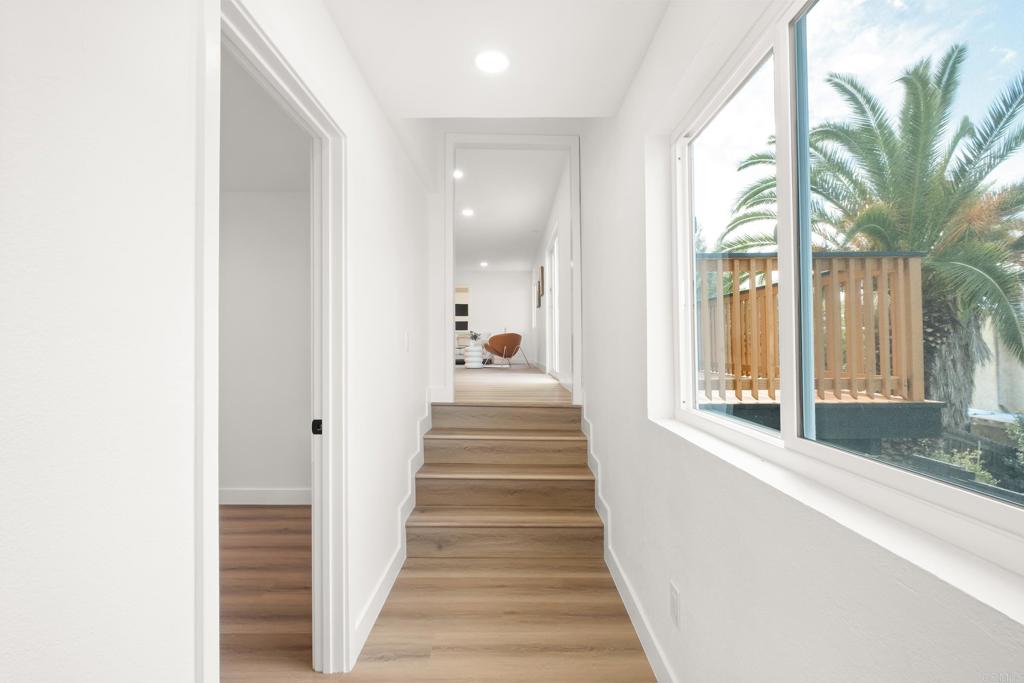 552 Felicita Avenue Spring Valley, CA 91977 - Photo 34 of 44 a view of a hallway with wooden floor and staircase