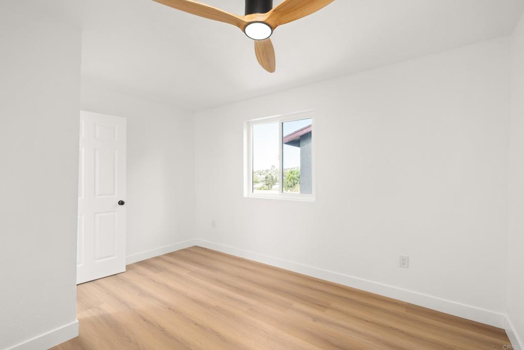 552 Felicita Avenue Spring Valley, CA 91977 - Photo 36 of 44 a view of a room with wooden floor and windows