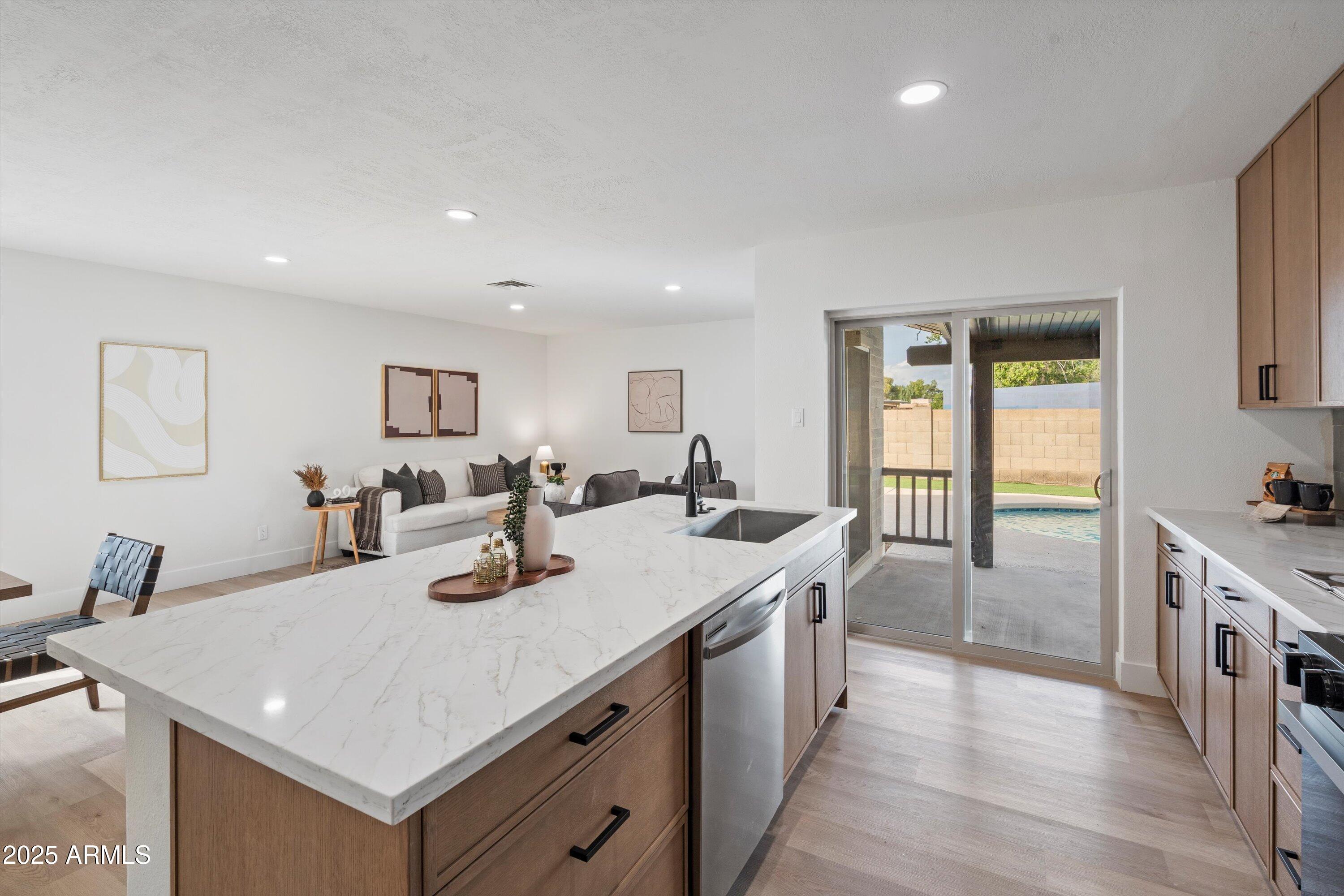 2116 East Colgate Drive Tempe, AZ 85283 - Photo 13 of 29 a large kitchen with sink a counter top space and stainless steel appliances