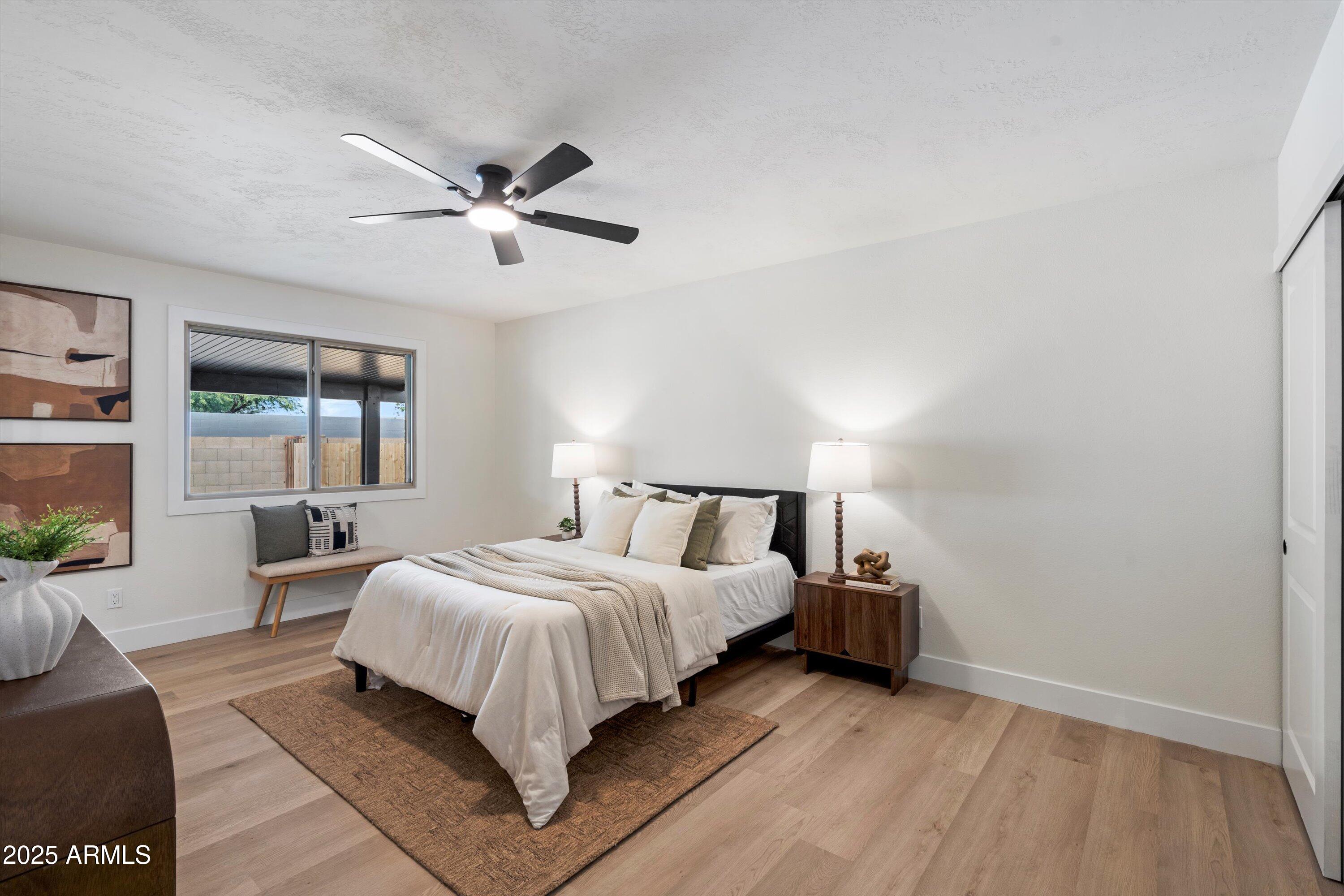 2116 East Colgate Drive Tempe, AZ 85283 - Photo 14 of 29 a bedroom with a bed and large window