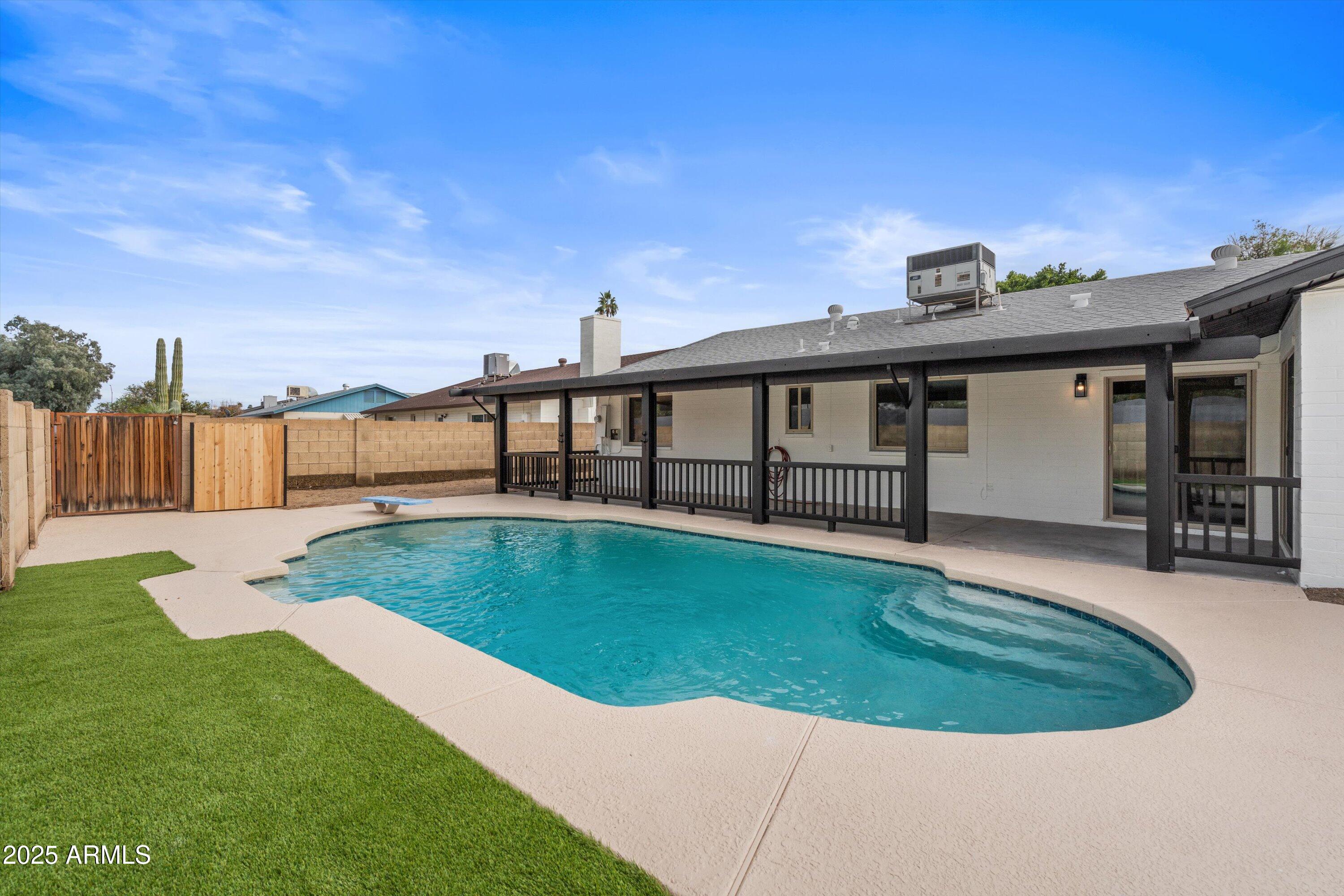 2116 East Colgate Drive Tempe, AZ 85283 - Photo 3 of 29 a view of a backyard with swimming pool