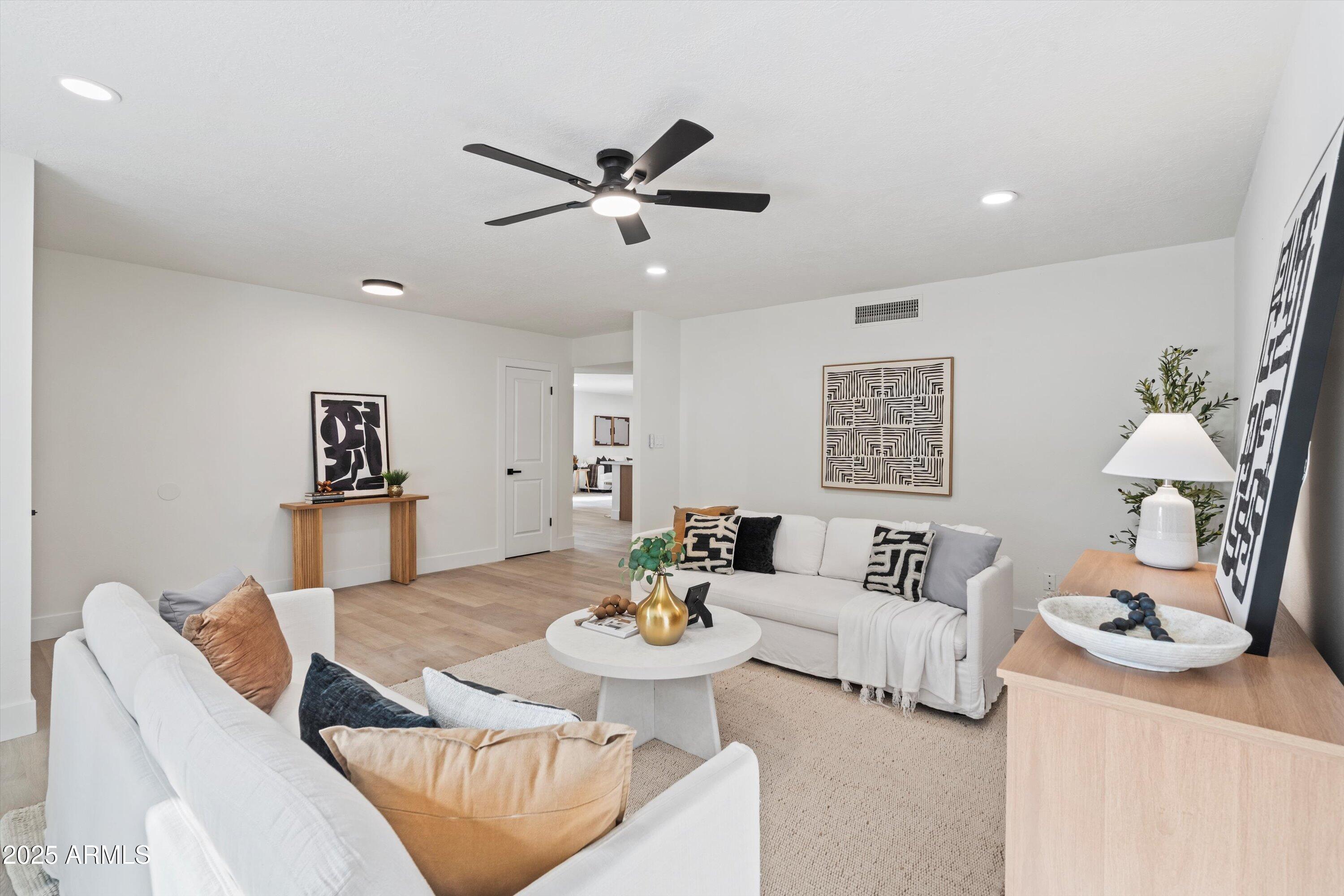 2116 East Colgate Drive Tempe, AZ 85283 - Photo 5 of 29 a living room with furniture and white walls