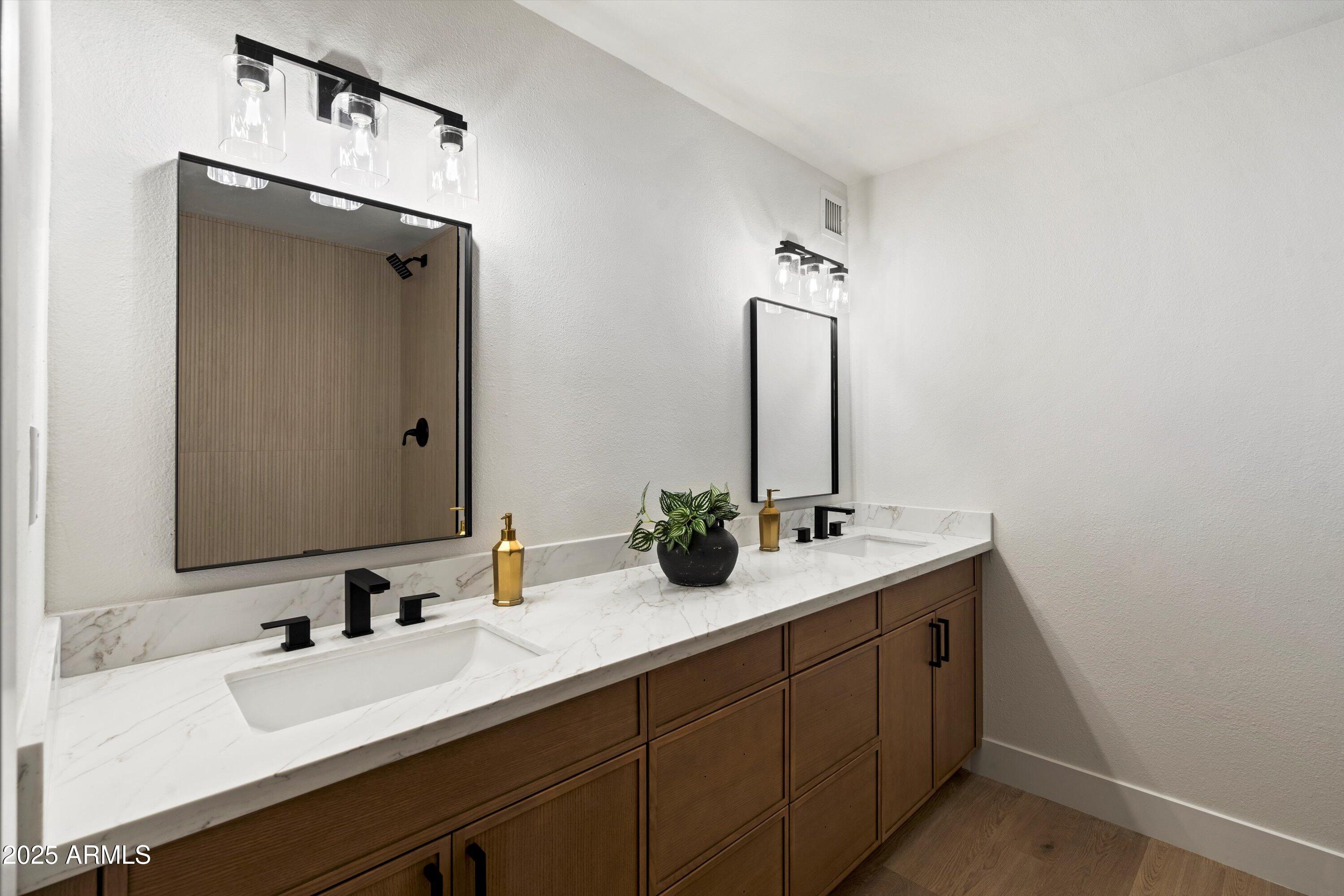 2116 East Colgate Drive Tempe, AZ 85283 - Photo 6 of 29 a bathroom with a double vanity sink and a mirror