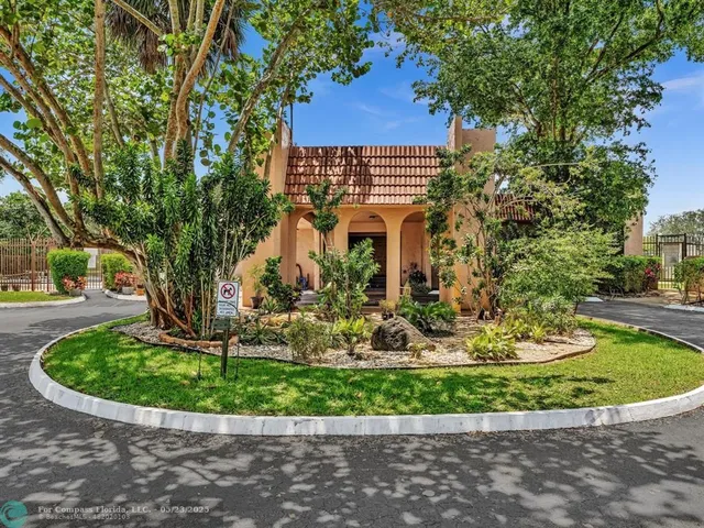 a view of a garden with a fountain