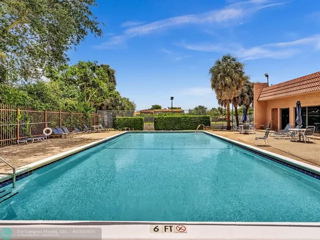 a view of a park with swings and slides