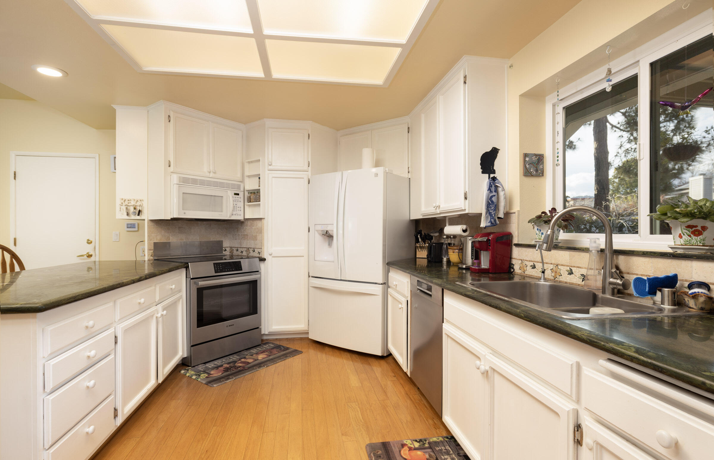 1539 Meadow Circle Carpinteria, CA 93013 - Photo 13 of 21 a kitchen with a sink stove and refrigerator