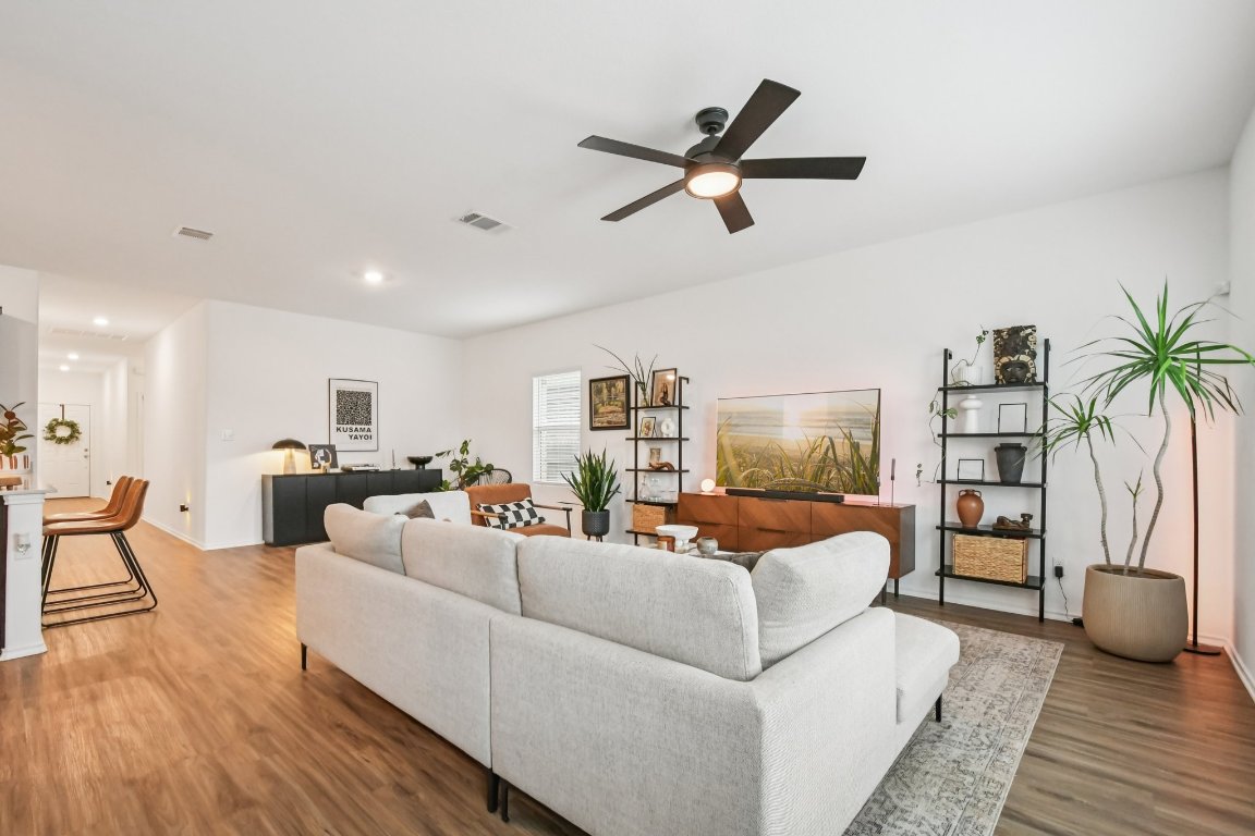 117 Badillo Way Bastrop, TX 78602 - Photo 13 of 40 a living room with furniture and a wooden floor