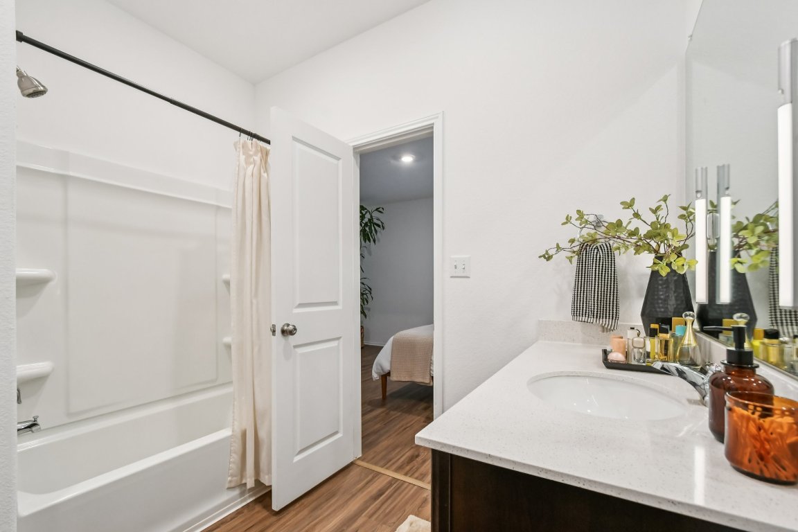 117 Badillo Way Bastrop, TX 78602 - Photo 25 of 40 a bathroom with a sink and a mirror