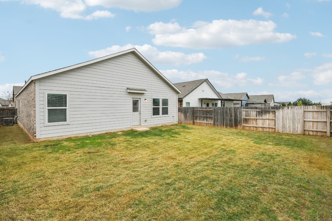117 Badillo Way Bastrop, TX 78602 - Photo 32 of 40 a view of a house with a backyard