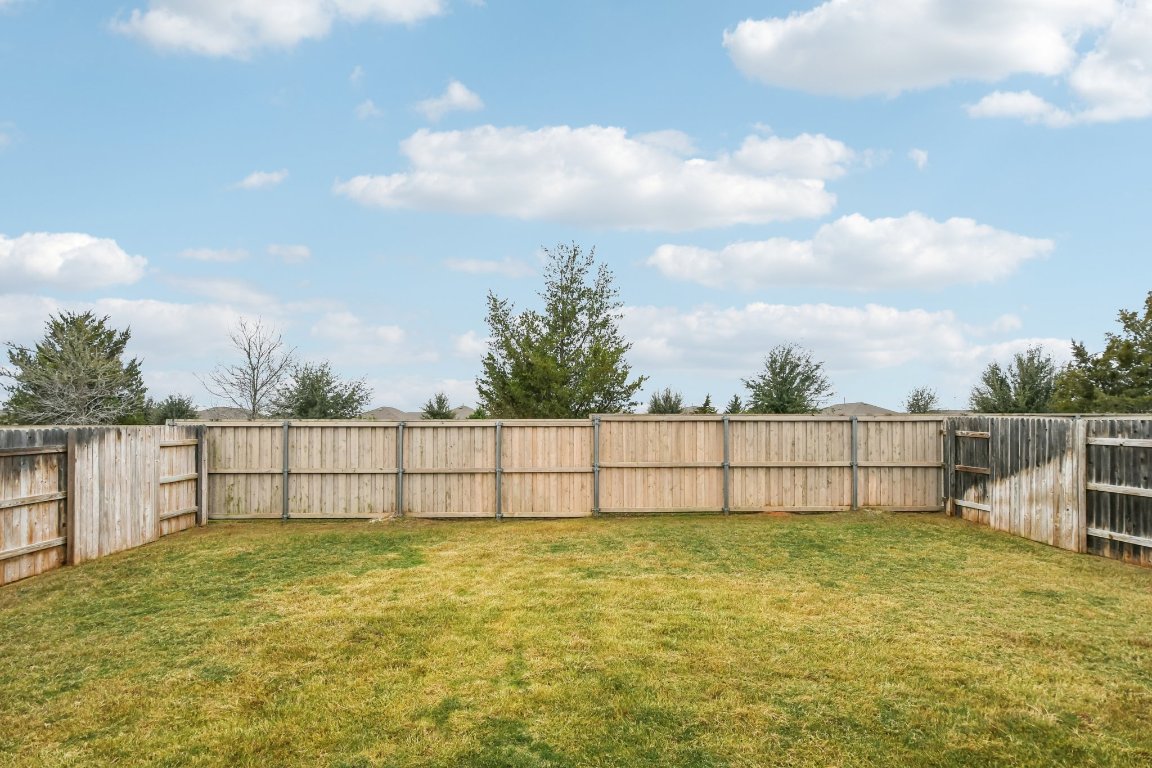 117 Badillo Way Bastrop, TX 78602 - Photo 33 of 40 a view of a yard with a fence
