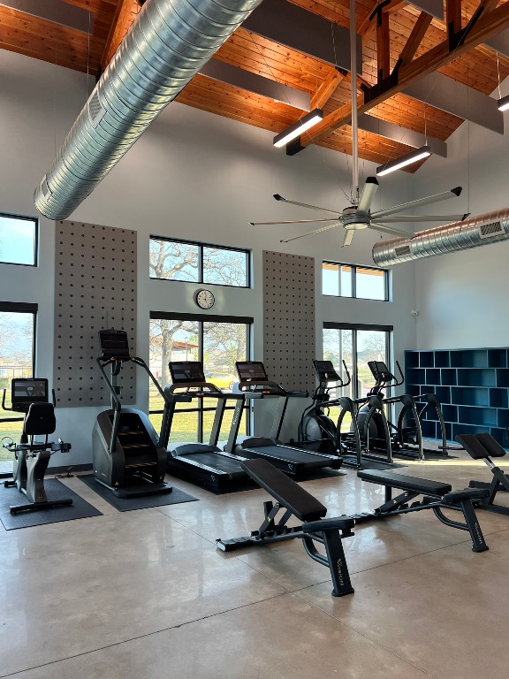 117 Badillo Way Bastrop, TX 78602 - Photo 35 of 40 a living room with furniture a air conditioner and a table