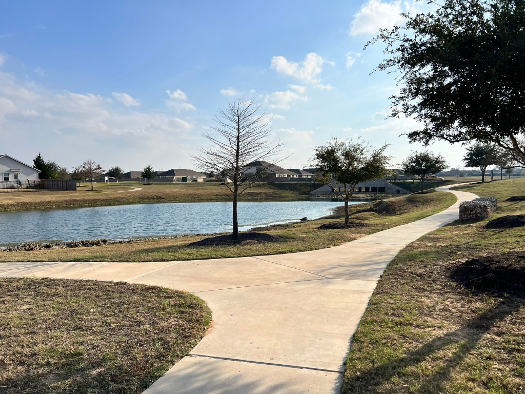 117 Badillo Way Bastrop, TX 78602 - Photo 37 of 40 a view of a swimming pool and an outdoor space