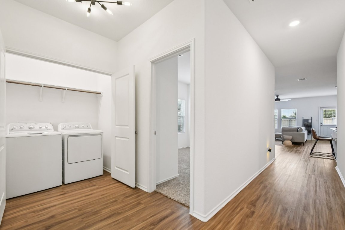 117 Badillo Way Bastrop, TX 78602 - Photo 6 of 40 a view of a room with wooden floor and electronic appliances