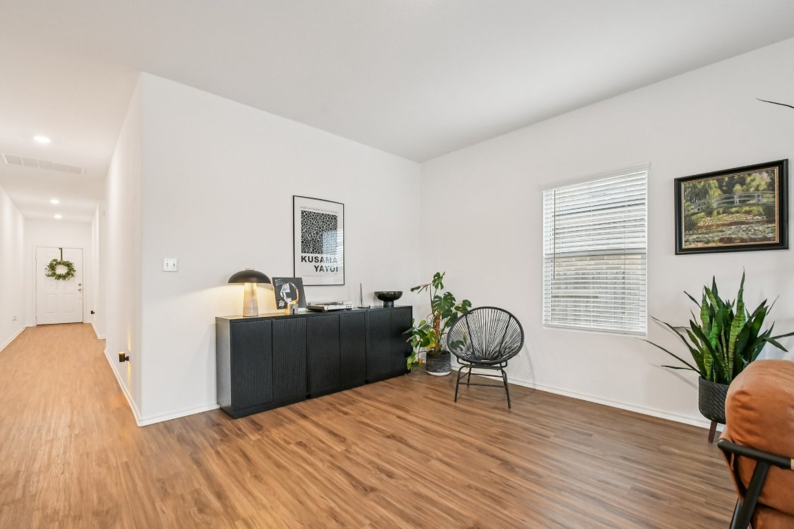 117 Badillo Way Bastrop, TX 78602 - Photo 8 of 40 a bedroom with furniture and wooden floor
