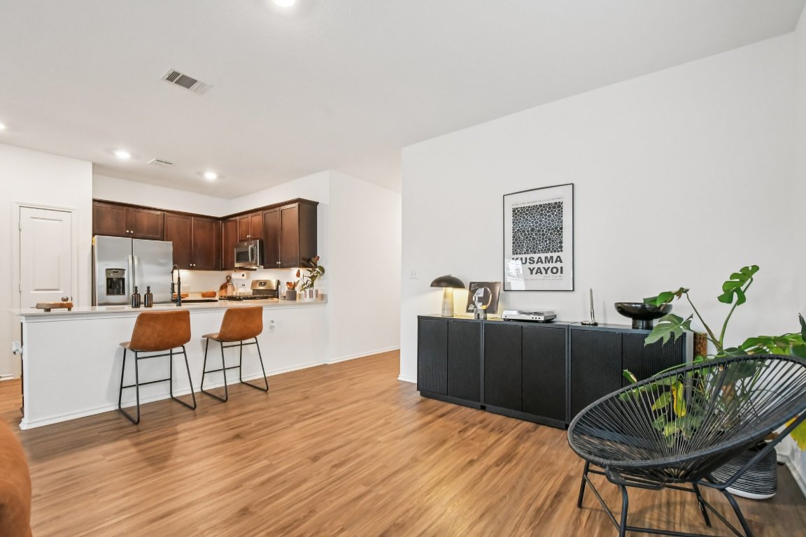 117 Badillo Way Bastrop, TX 78602 - Photo 40 of 40 a living room with furniture and a wooden floor
