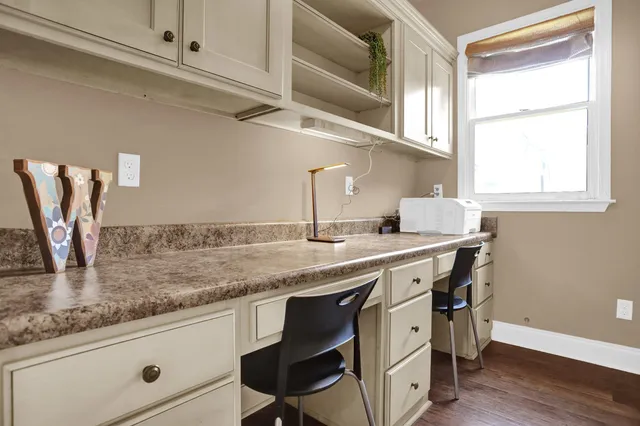 a kitchen with cabinets appliances and a window