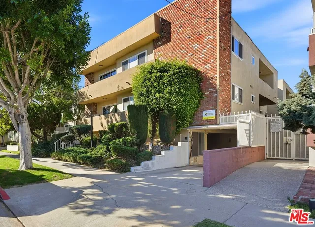 a bathroom with a granite countertop sink and mirror