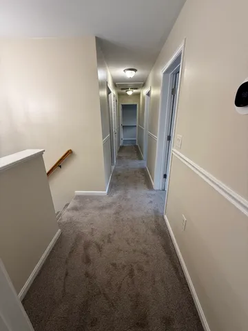 a bathroom with a granite countertop sink toilet a mirror and shower
