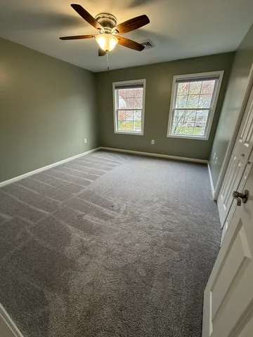a bathroom with a bathtub and window
