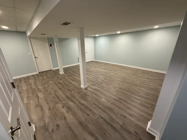 a view of a backyard with large trees