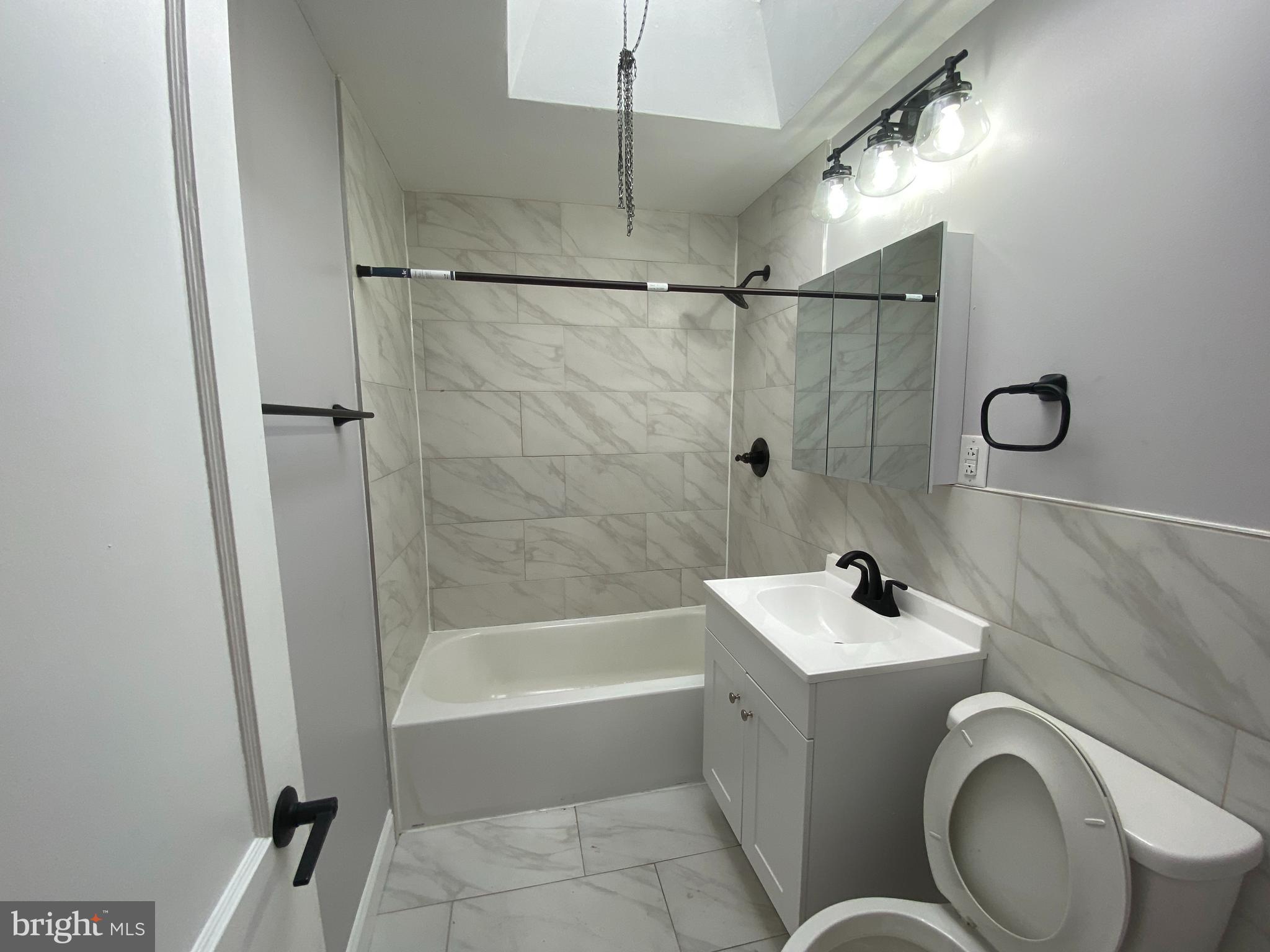 365 Ripka Street Philadelphia, PA 19128 - Photo 7 of 10 a bathroom with a sink a toilet and shower