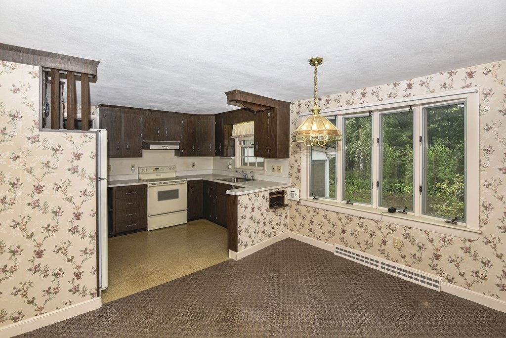 35 Old Post Road Walpole, MA 02032 - Photo 8 of 32 a open kitchen with granite countertop a stove a sink dishwasher and a refrigerator with wooden floor