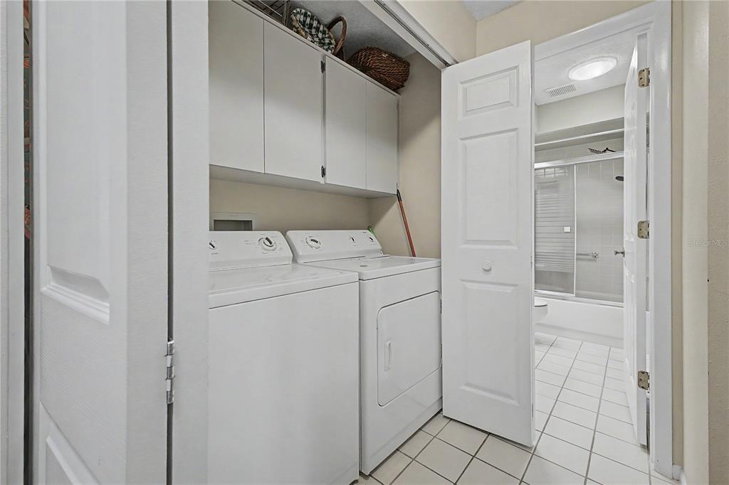 2662 Appleleaf Court Spring Hill, FL 34606 - Photo 22 of 47 a utility room with cabinets washer and dryer