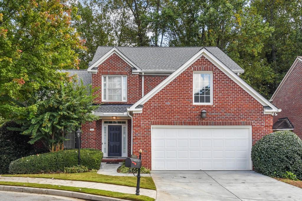 a view of a yard in front view of a house