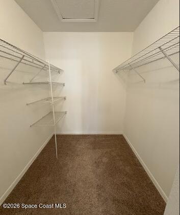 1927 Quail Ridge Court, Unit 1404 Cocoa, FL 32926 - Photo 14 of 23 a view of a room with racks on the wall